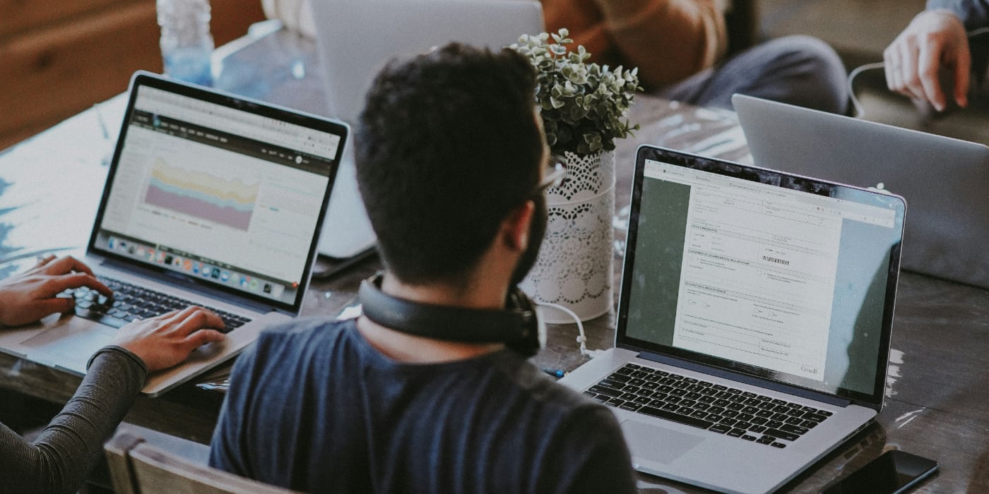 Man sitting at table with laptop